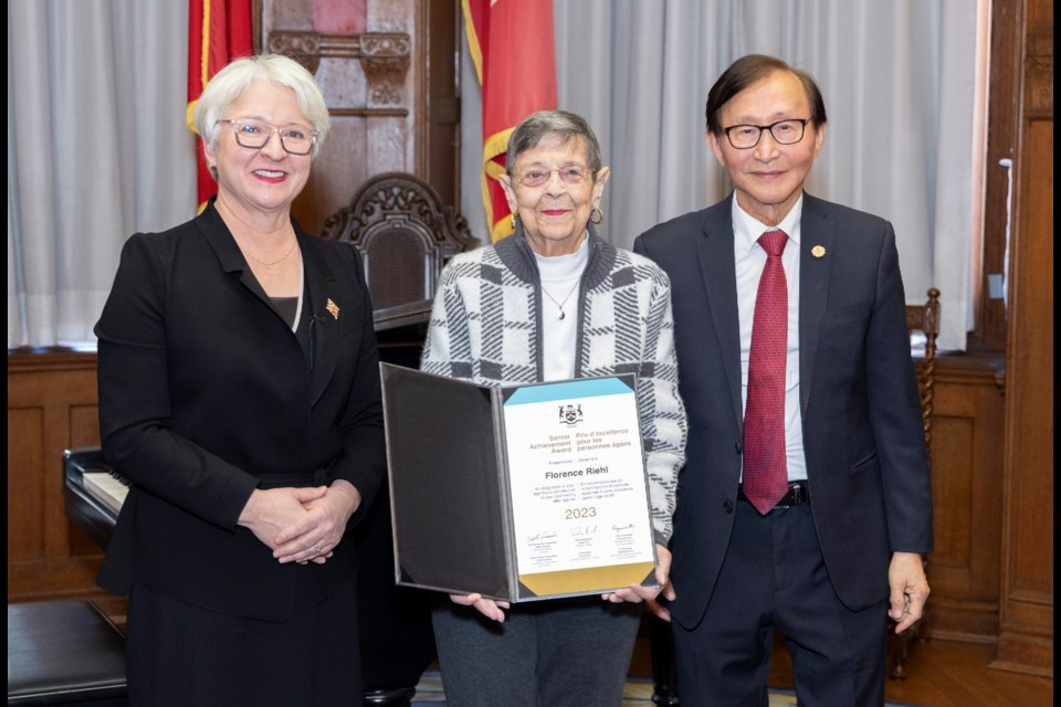 Georgetown's Florence Riehl is presented with an Ontario Senior Achievement Award by Edith Dumont, Lieutenant Governor of Ontario (left) and Raymond Cho, Minister for Seniors and Accessibility (right).